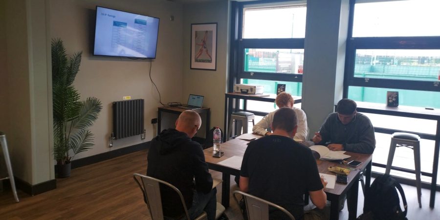 Manchester venue internal shot with 4 delegates learning on the PAT course